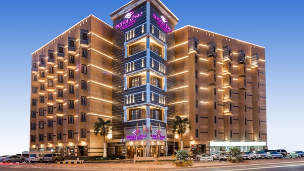 A multi-story hotel with a modern design, featuring balconies and a prominent entrance. - Boudl Al Maidan (Hafr Al Batin)