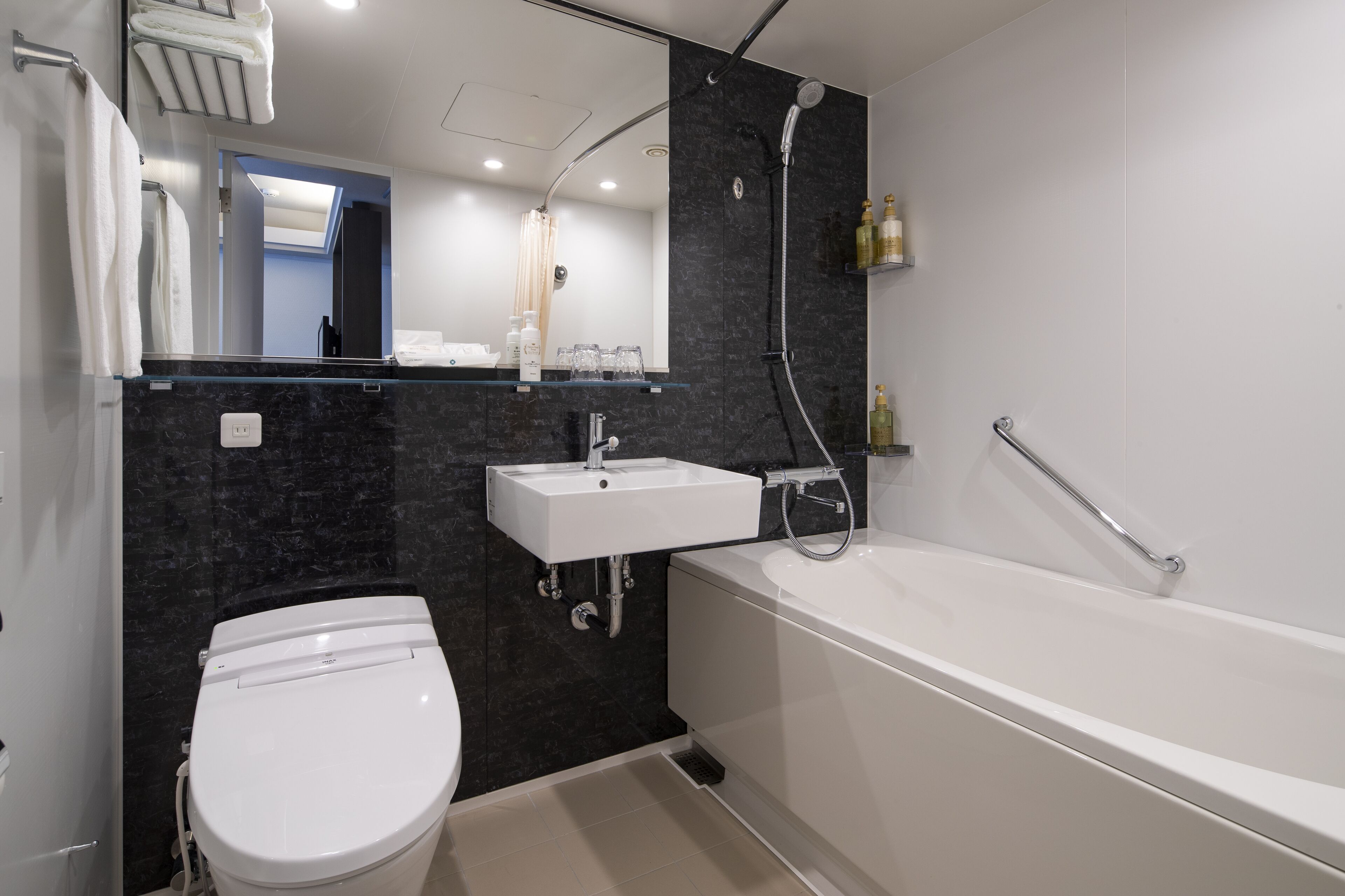 combined shower/bathtub, hair dryer, slippers, electronic bidet