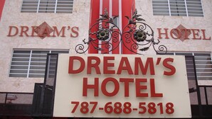 A sign for Dream's Hotel with the name and phone number clearly displayed. - Dream's Hotel Puerto Rico (San Juan)