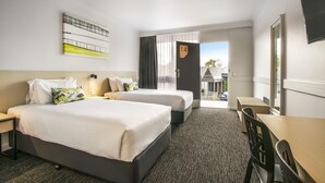 A hotel room with two beds, a desk, and a TV. - Nightcap at Matthew Flinders Hotel (Chadstone)