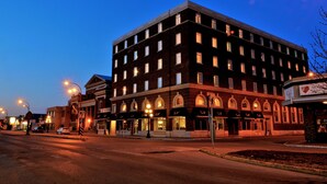 A multi-story hotel with a classic architectural design, featuring arched windows and a central entrance. - Grant Hall Hotel (Moose Jaw)