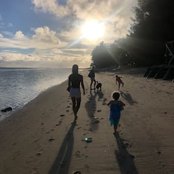 On the beach, white sand, sun-loungers, beach towels
