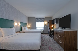 A hotel room with two beds, a desk, a television, and a window with a view. - Home2 Suites by Hilton West Edmonton, Alberta, Canada (Edmonton)
