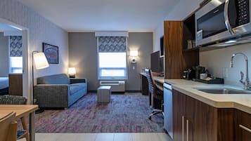 Studio, 2 Queen Beds, Non Smoking | Living area | 42-inch flat-screen TV with cable channels, TV, iPod dock