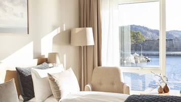 Premium bedding, pillow-top beds, laptop workspace, blackout curtains