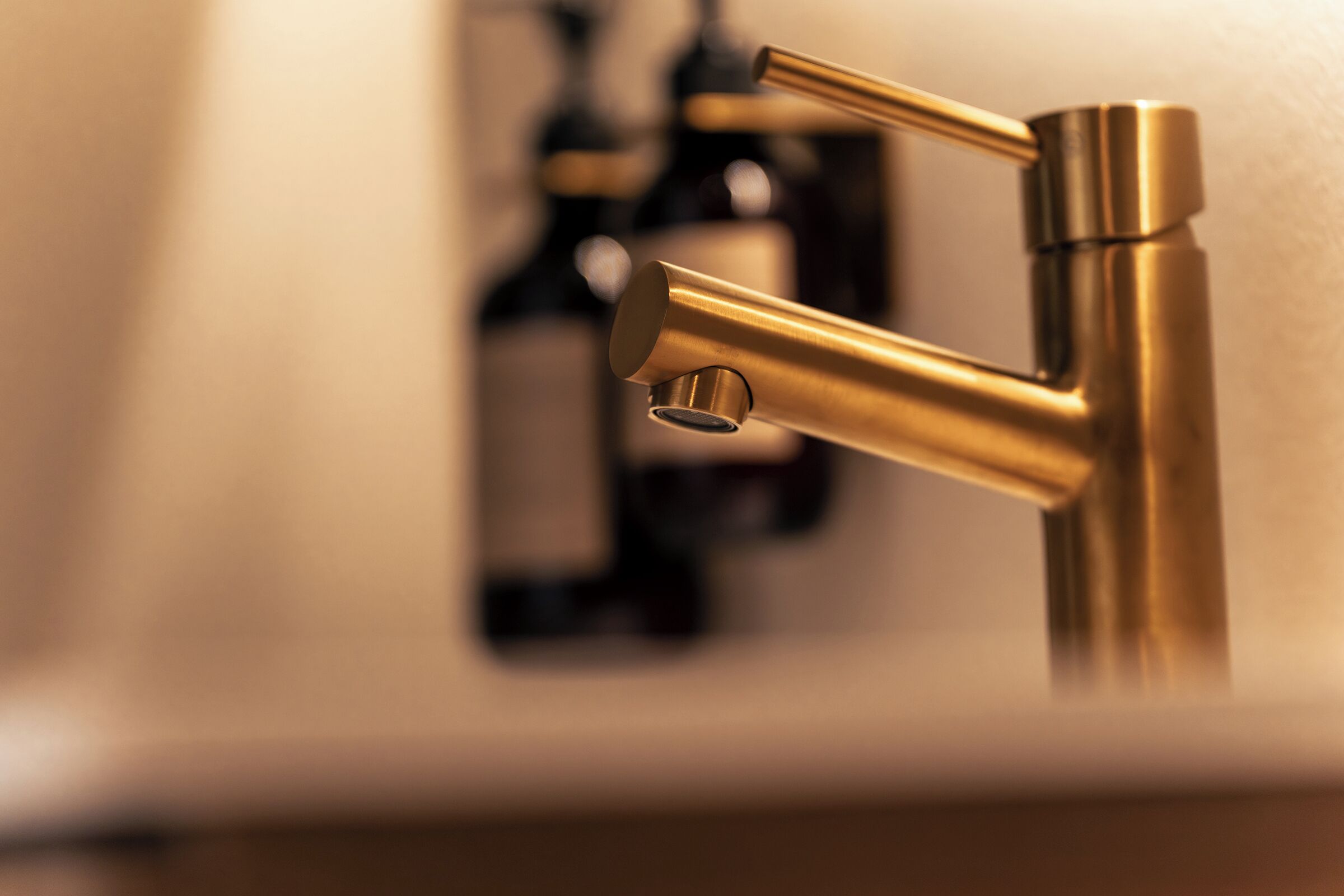 A close-up of a metallic faucet with a modern design.