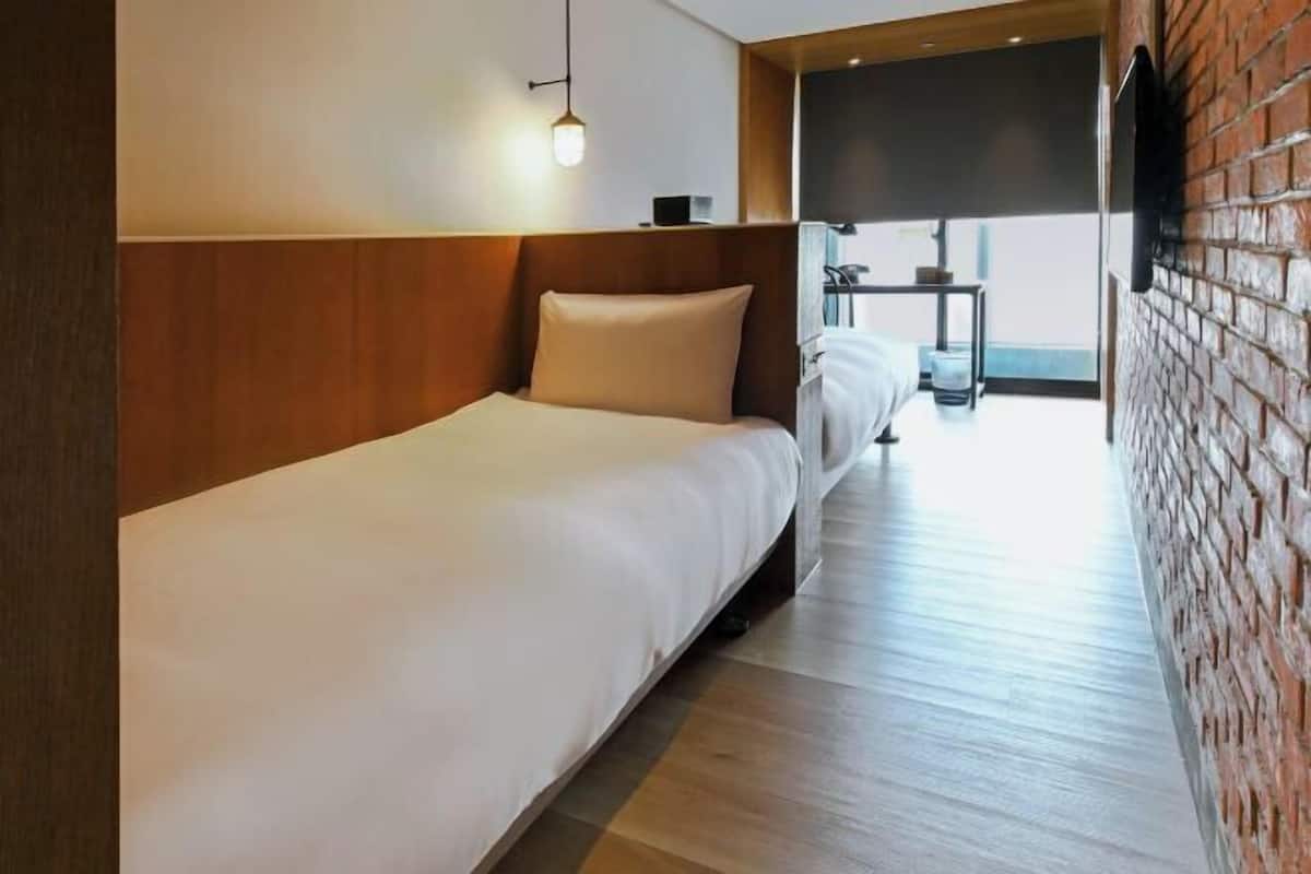 Desk, laptop workspace, free WiFi, bed sheets