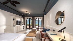 A modern bedroom with a large bed, a desk, and a view of the ocean. - Casa Nonna Bodrum - Adult Only (Bodrum)