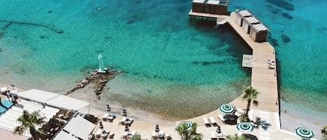 Private beach, free beach shuttle, beach cabanas, sun loungers