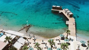 Outdoor pool, free pool cabanas, pool umbrellas