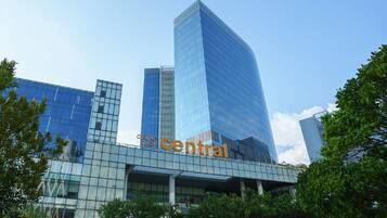 A modern building with a prominent glass facade and the word 'central' displayed.