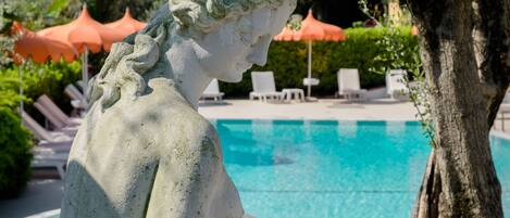 Seasonal outdoor pool, pool umbrellas, pool loungers