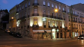 A multi-story hotel with balconies, a ground-level restaurant, and a visible sign for 'Resort Hotel'. - Estrela de Arganil (Lisbon)