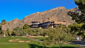 A golf course with a clubhouse and mountains in the background. - Mission Hill Casitas (Tucson)