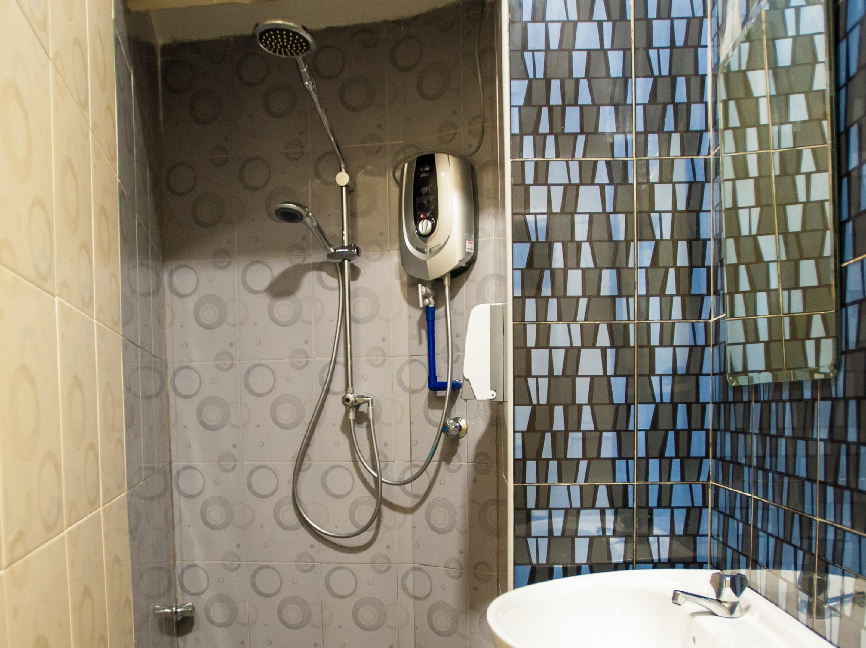 deluxe triple room | bathroom | shower, rainfall showerhead, free toiletries, bidet