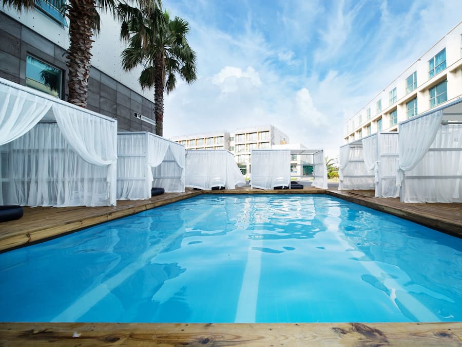 2 outdoor pools, open 2:00 PM to 10:00 PM, pool cabanas (surcharge)