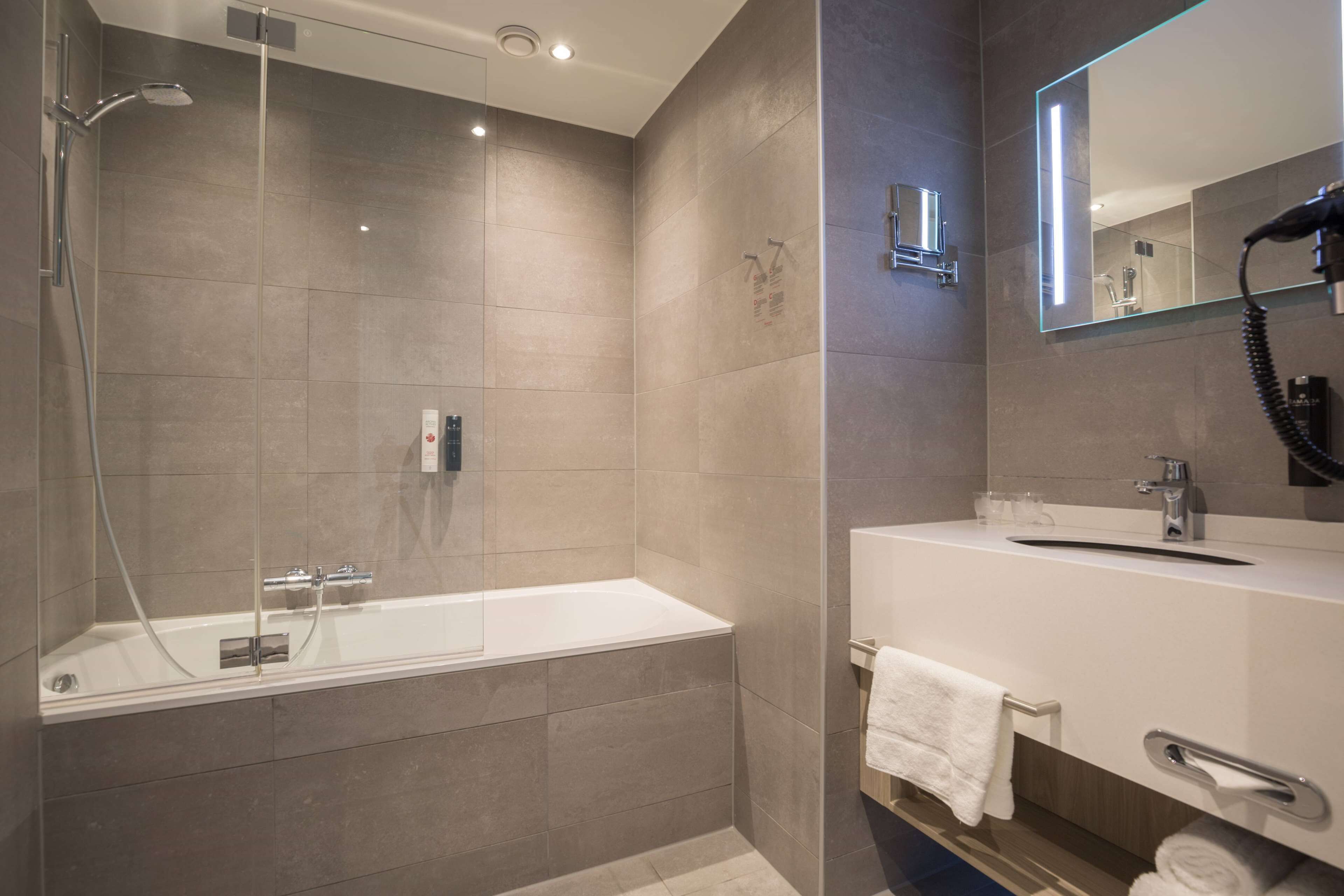 eco-friendly toiletries, hair dryer, towels