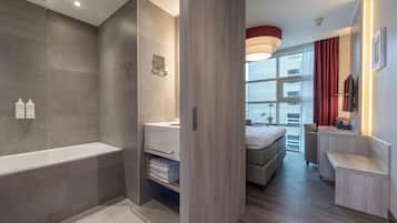 Family Room, Multiple Beds | Bathroom | Eco-friendly toiletries, hair dryer, towels