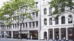 A street view of a building with multiple storefronts, including a restaurant and a coffee shop. - The Hoxton, Holborn (London)