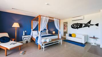 A modern bedroom with a four-poster bed, a nightstand, a bedside table, a lamp, a bench, a sofa, a small table, and a wall-mounted fish decoration.