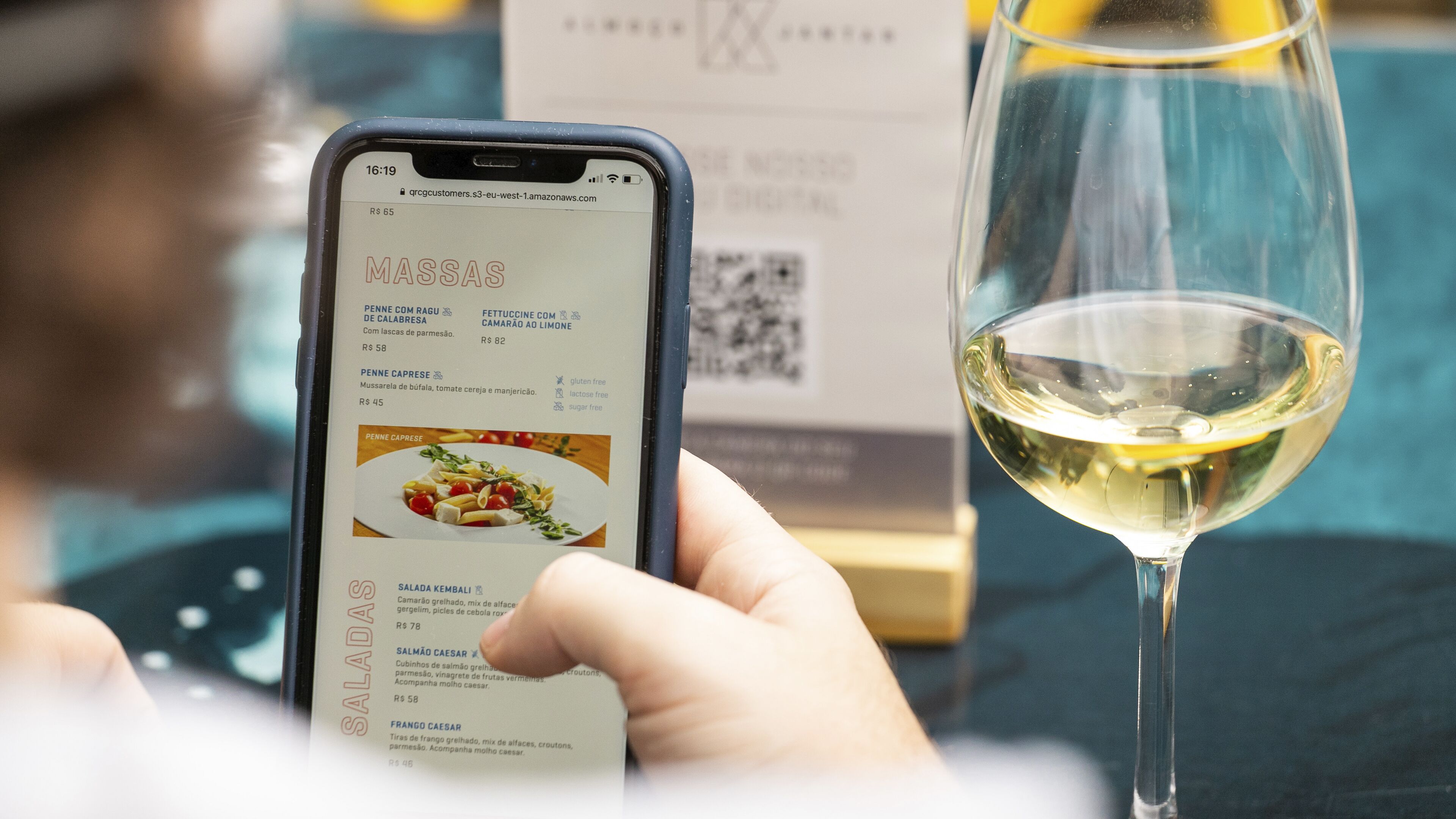 A smartphone displaying a restaurant menu with various dishes and prices.