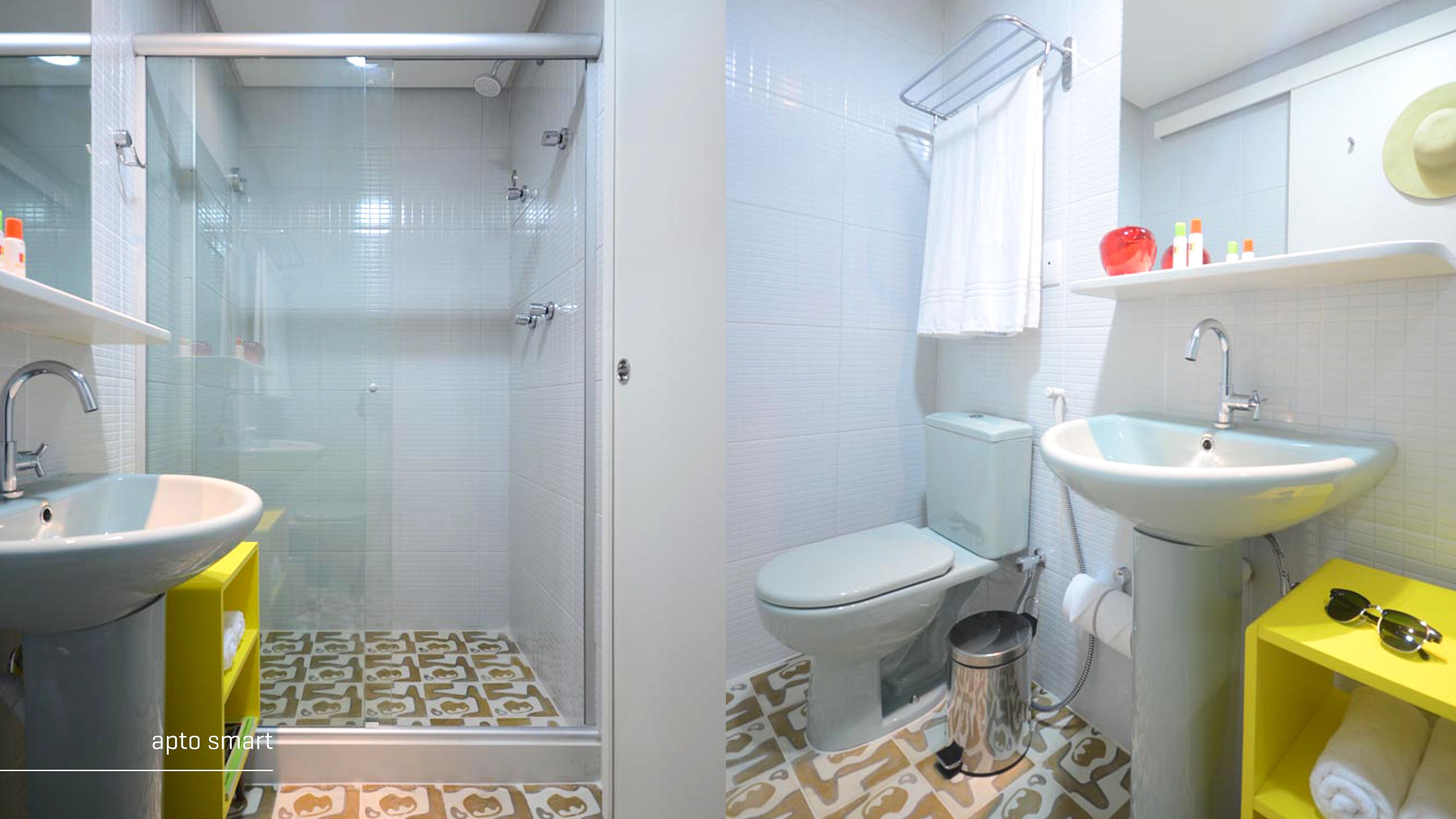 A bathroom with a glass-enclosed shower, a toilet, a sink, and a yellow shelf with toiletries.
