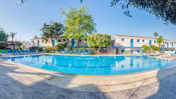 Seasonal outdoor pool, open 8:00 AM to 8:00 PM, pool umbrellas