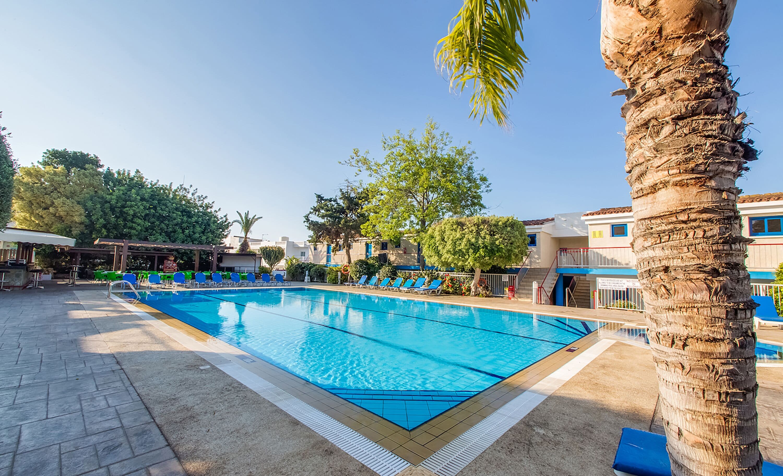 Seasonal outdoor pool, open 8:00 AM to 8:00 PM, pool umbrellas