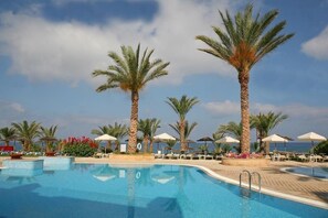 Indoor pool, outdoor pool, pool umbrellas, sun loungers - St. George Gardens (Paphos)