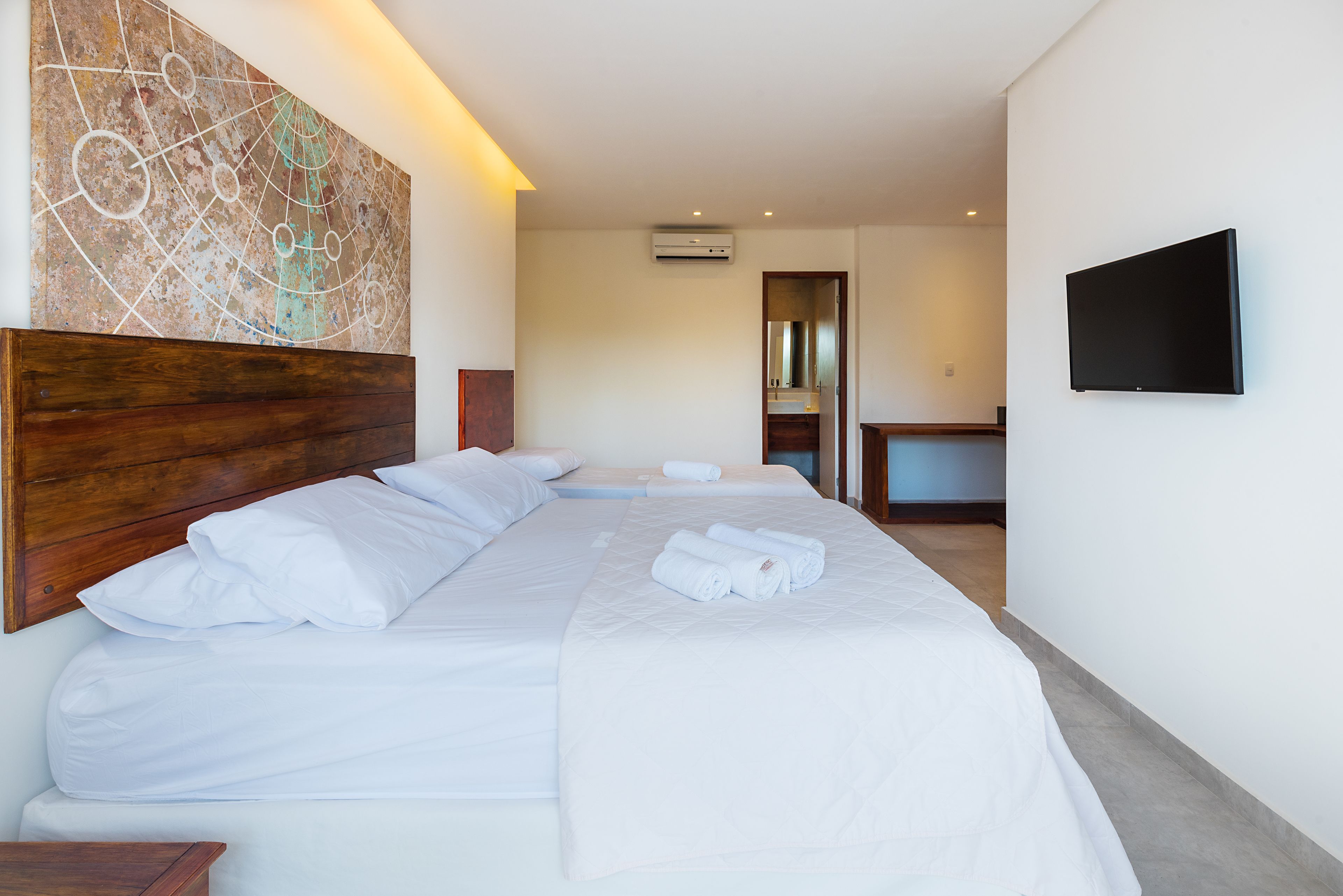 deluxe triple room | 1 bedroom, minibar, in-room safe, blackout curtains