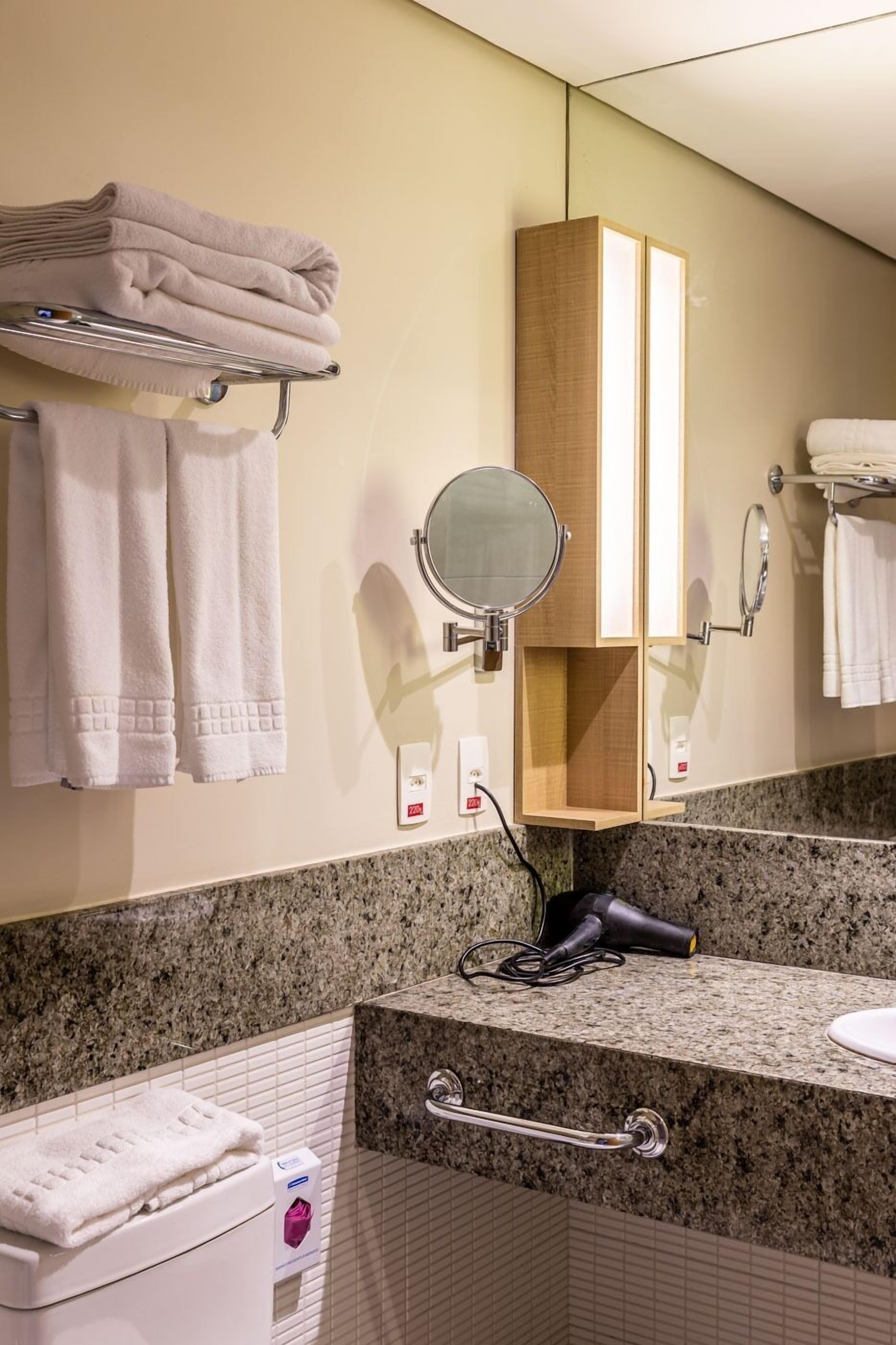 superior female room | bathroom | shower, rainfall showerhead, free toiletries, hair dryer