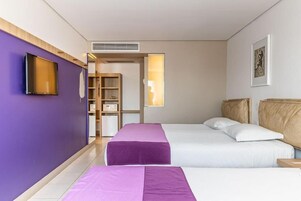 Family Room | Minibar, in-room safe, desk, blackout drapes