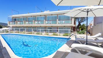 Outdoor pool, open 9:00 AM to 9:00 PM, pool umbrellas, sun loungers
