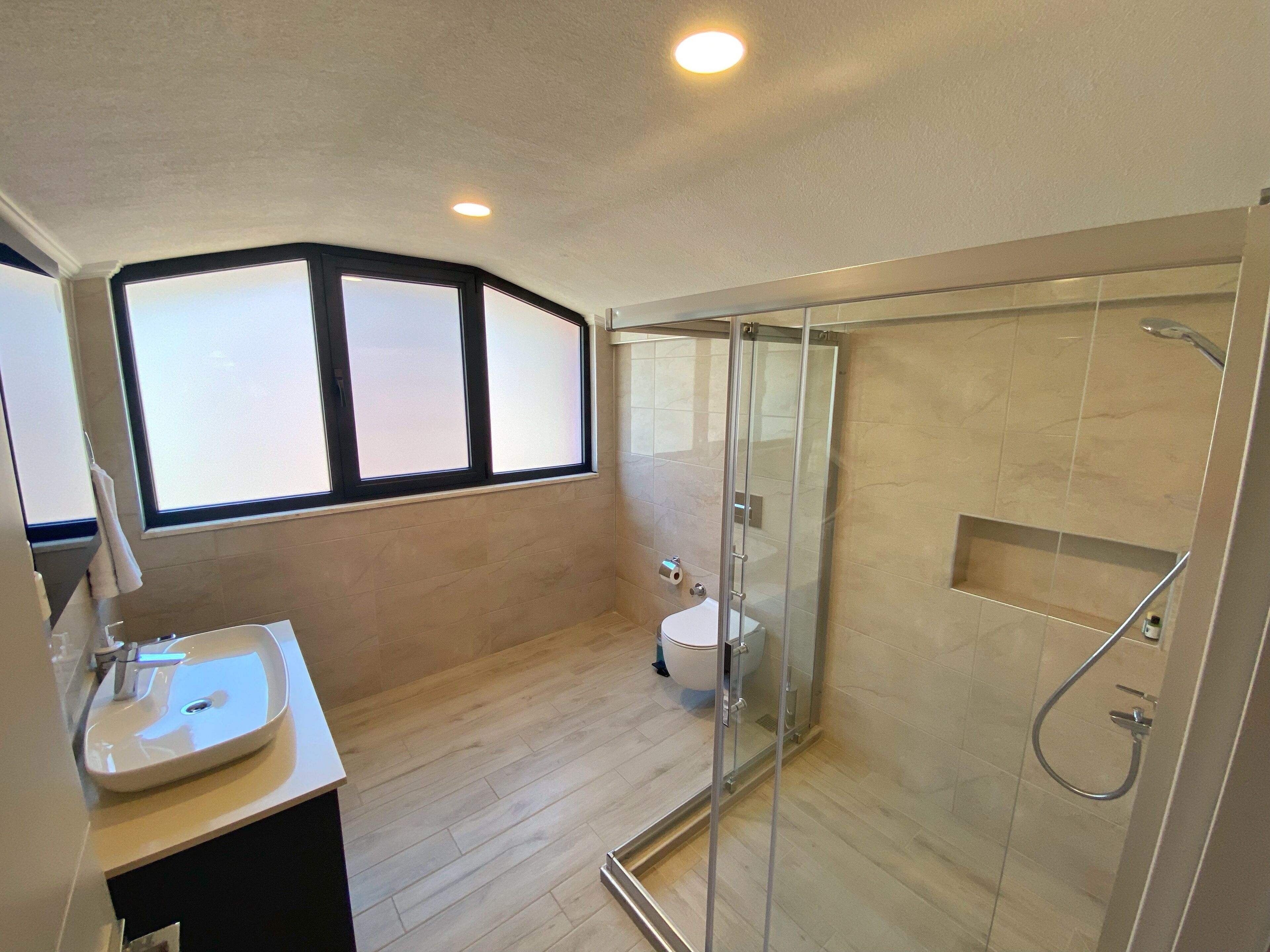 panoramic room, mountain view | bathroom | hair dryer, slippers, towels, soap