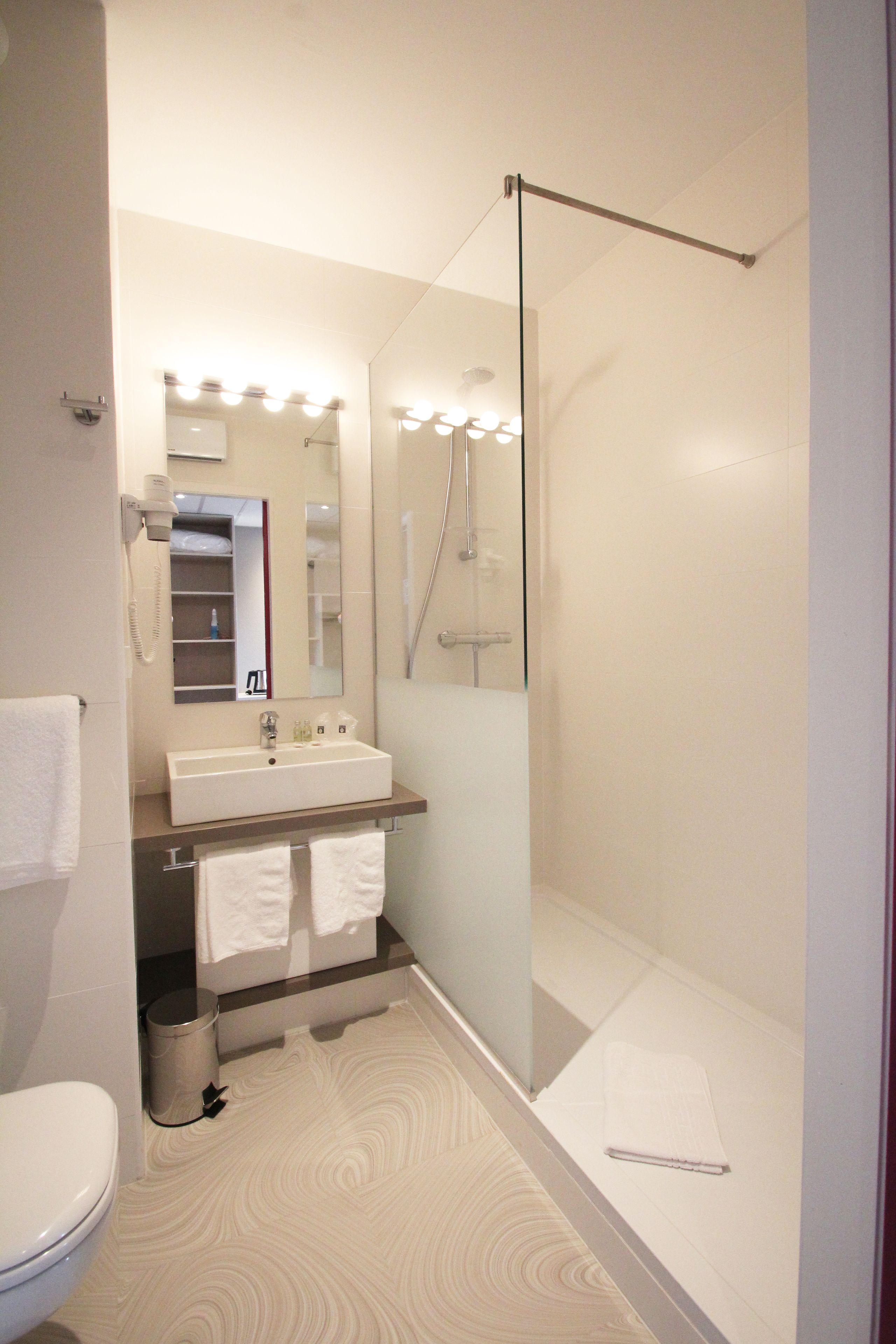 shower, free toiletries, hair dryer, towels