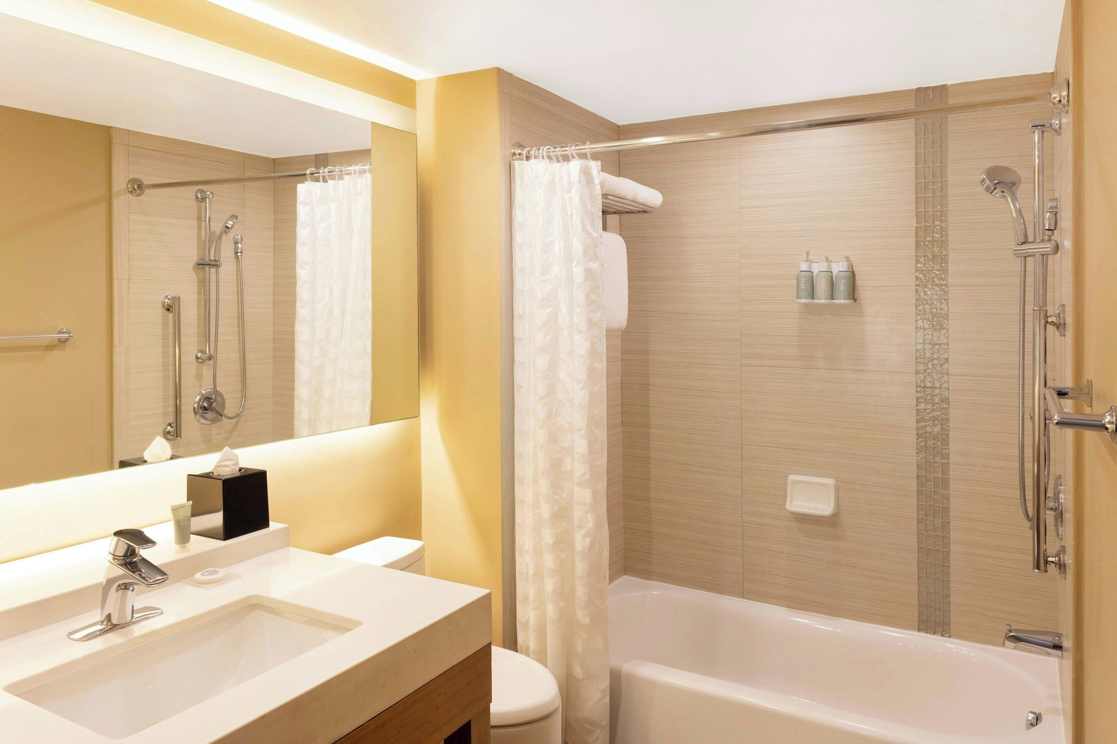 shower, designer toiletries, hair dryer, towels