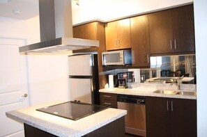 Full-sized fridge, microwave, stovetop, dishwasher