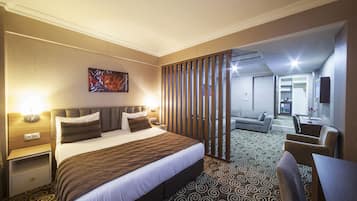 Standard Suite | Living area | 82-cm LCD TV with satellite channels, TV, heated floors