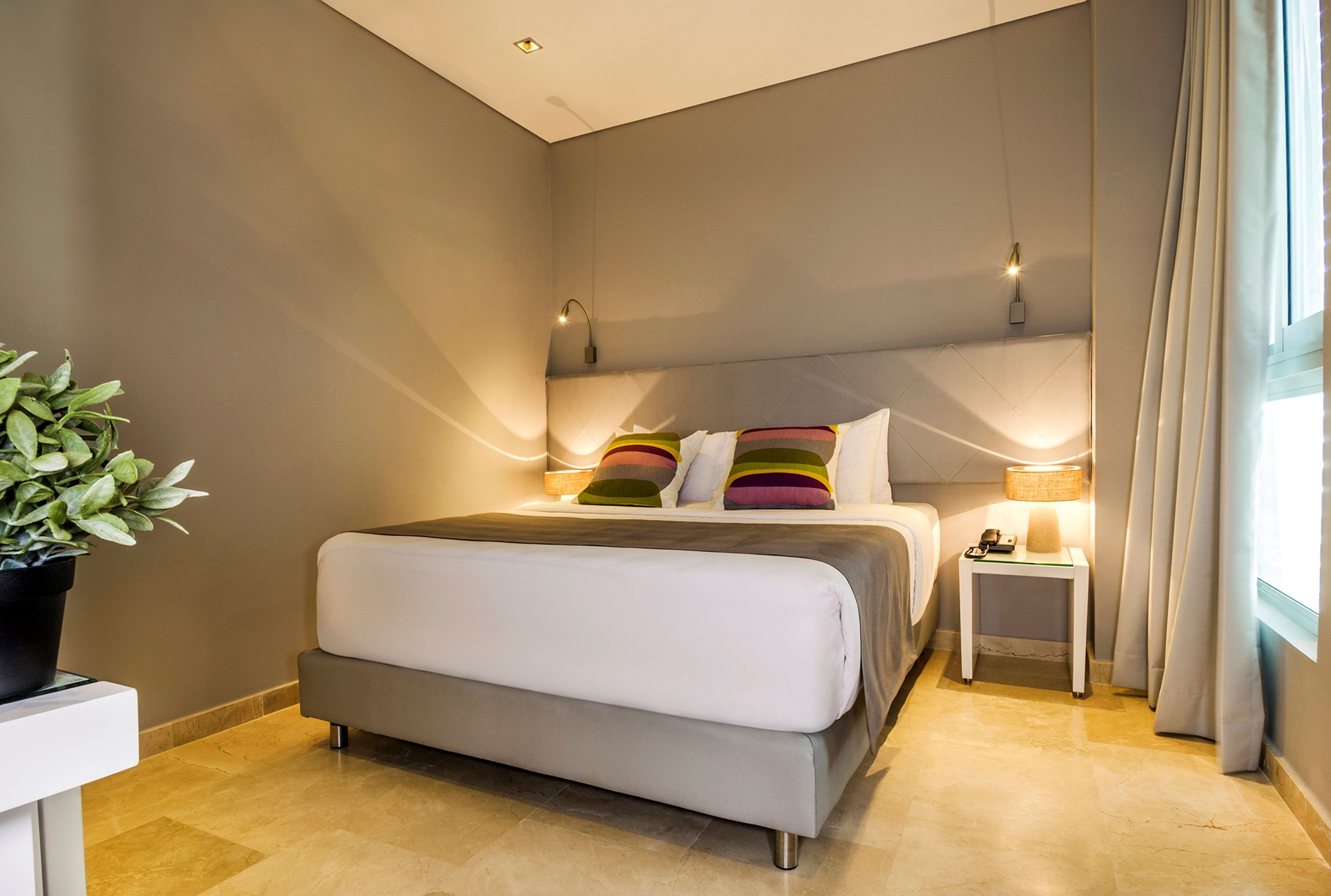 Premium bedding, down comforters, pillowtop beds, minibar