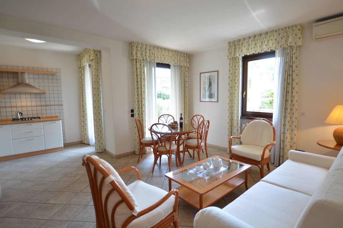Apartment, 1 Bedroom, Balcony | Living area | LCD TV
