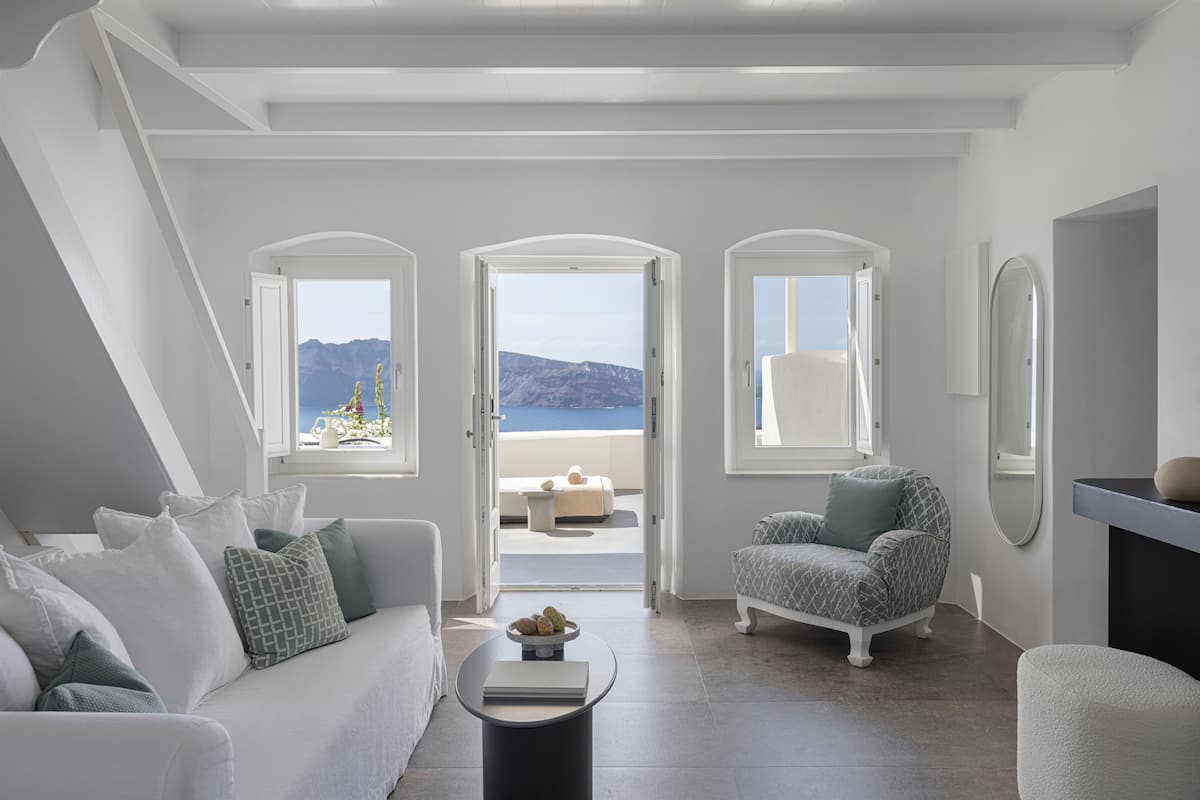 Canaves Suite with Private Pool | Living area | 32-inch flat-screen TV with satellite channels, TV