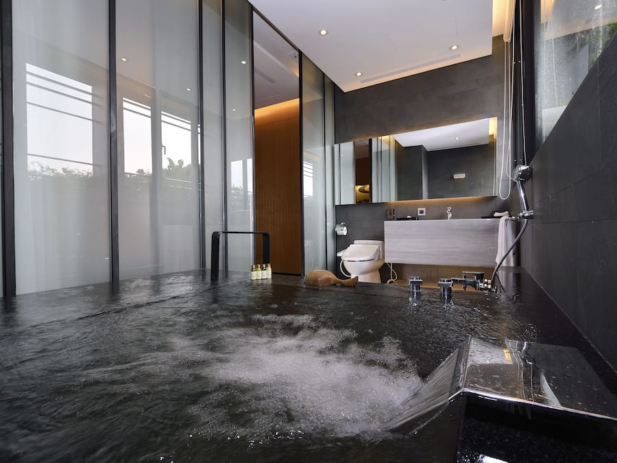 Separate bathtub and shower, hair dryer, slippers, towels