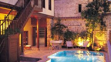 Seasonal outdoor pool, pool umbrellas, pool loungers