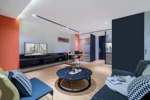 One-Bedroom Executive | Living area | LCD TV, DVD player, iPod dock