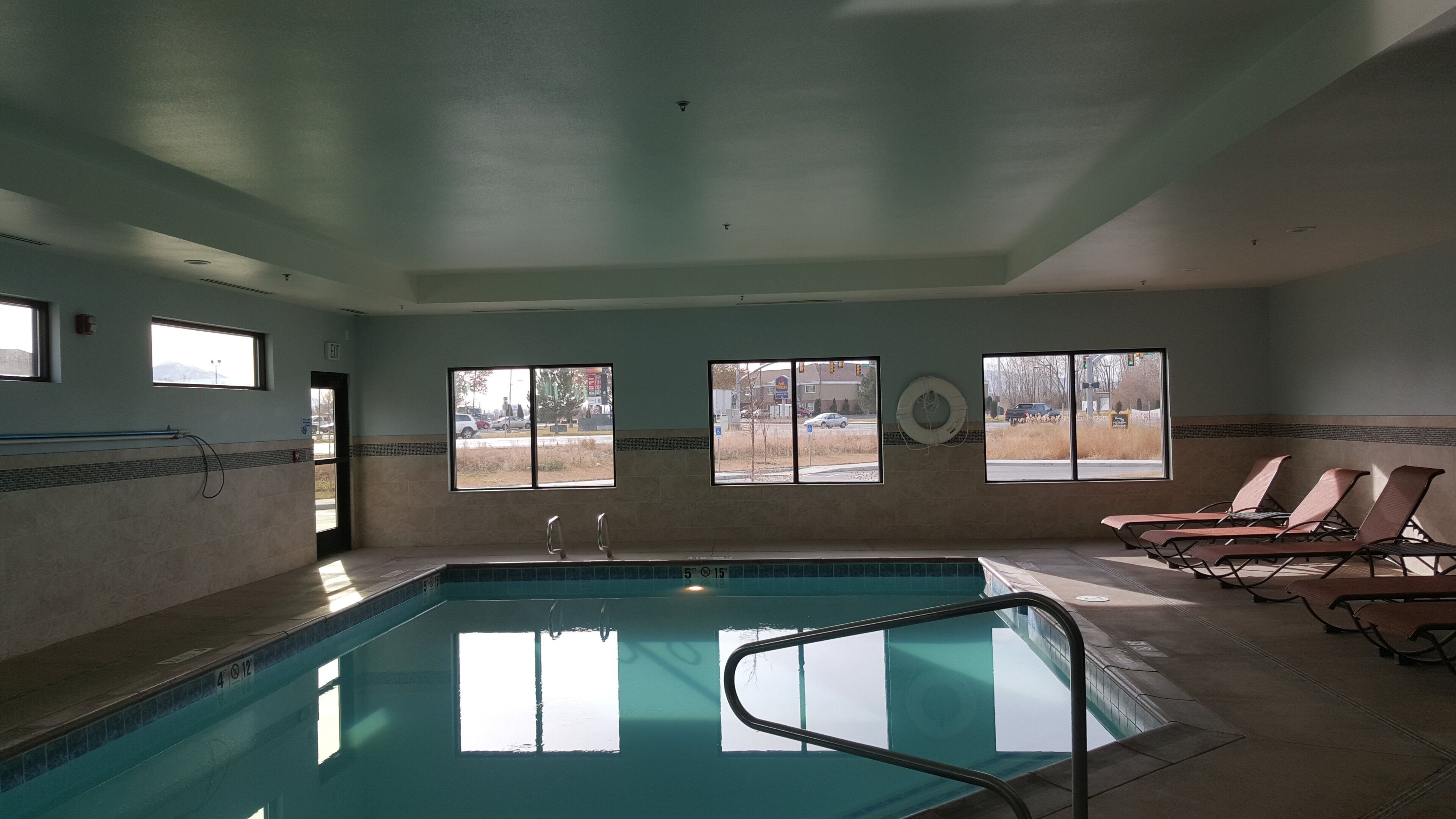 Indoor pool, open 8:00 AM to 10:00 PM, pool loungers