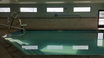 Indoor pool, open 8:00 AM to 10:00 PM, pool loungers