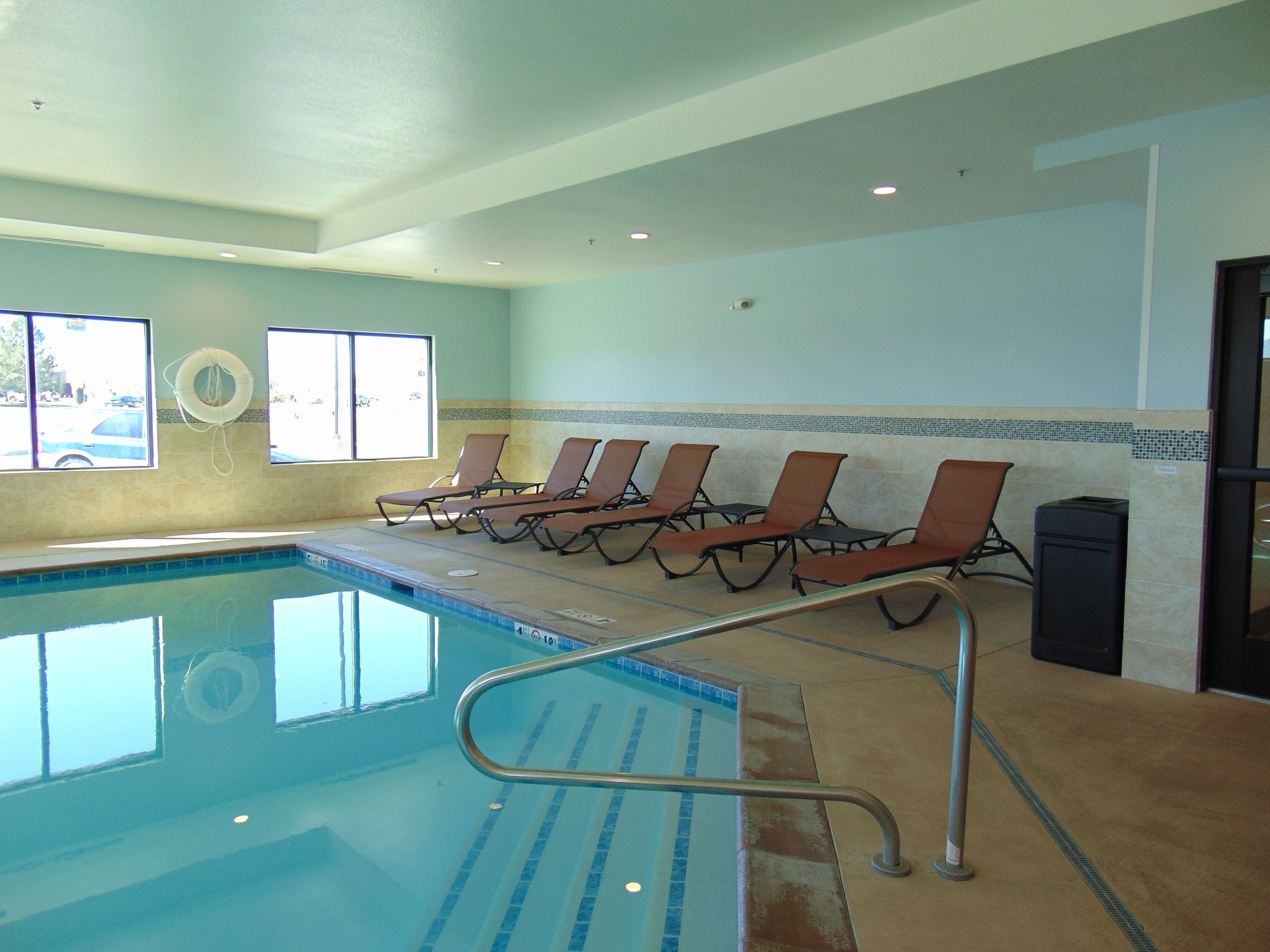 Indoor pool, open 8:00 AM to 10:00 PM, pool loungers