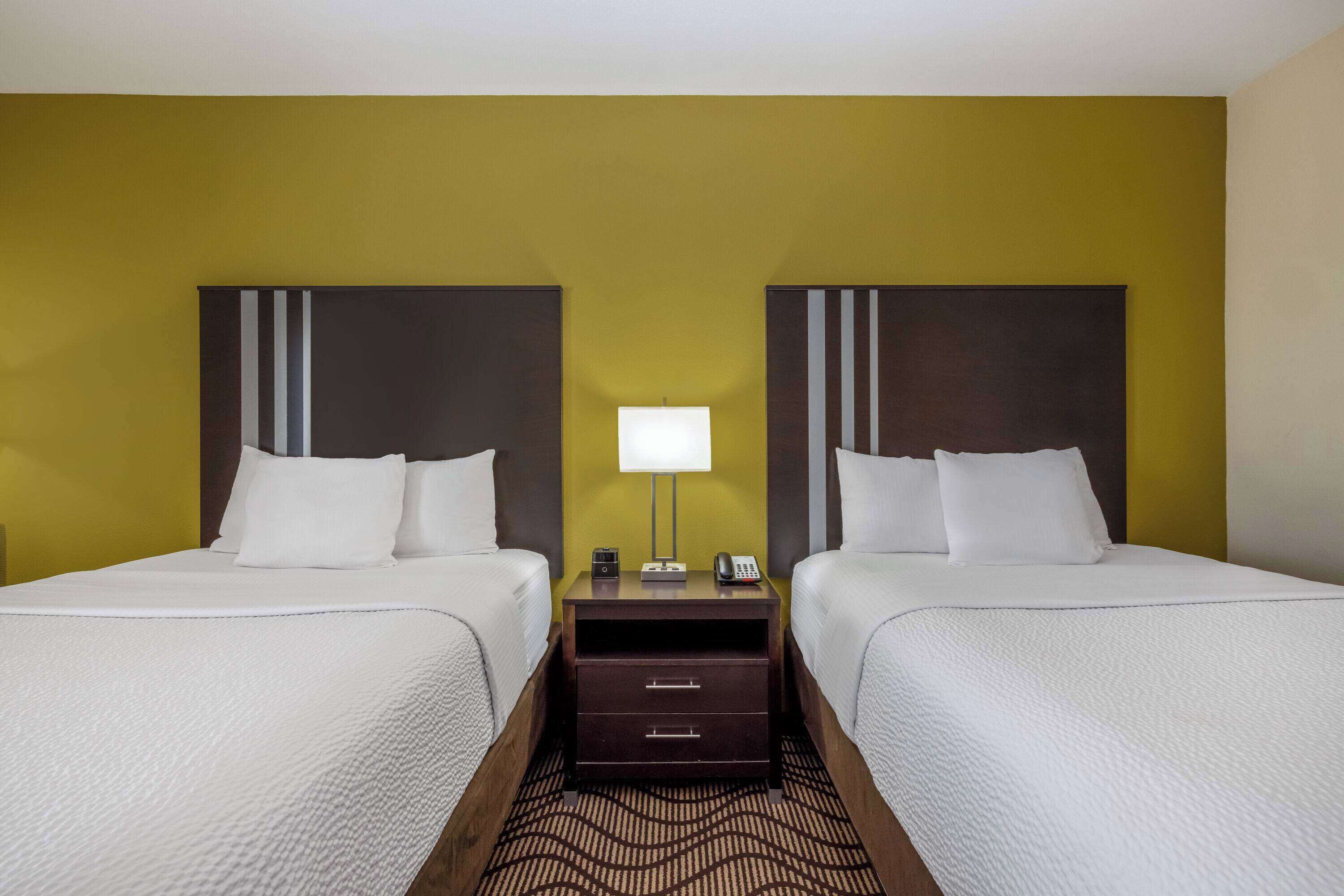 premium bedding, pillow-top beds, desk, blackout curtains