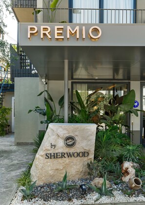 A hotel entrance with a sign reading "PREMIO by SHERWOOD". - Sherwood Premio Hotel (Antalya)