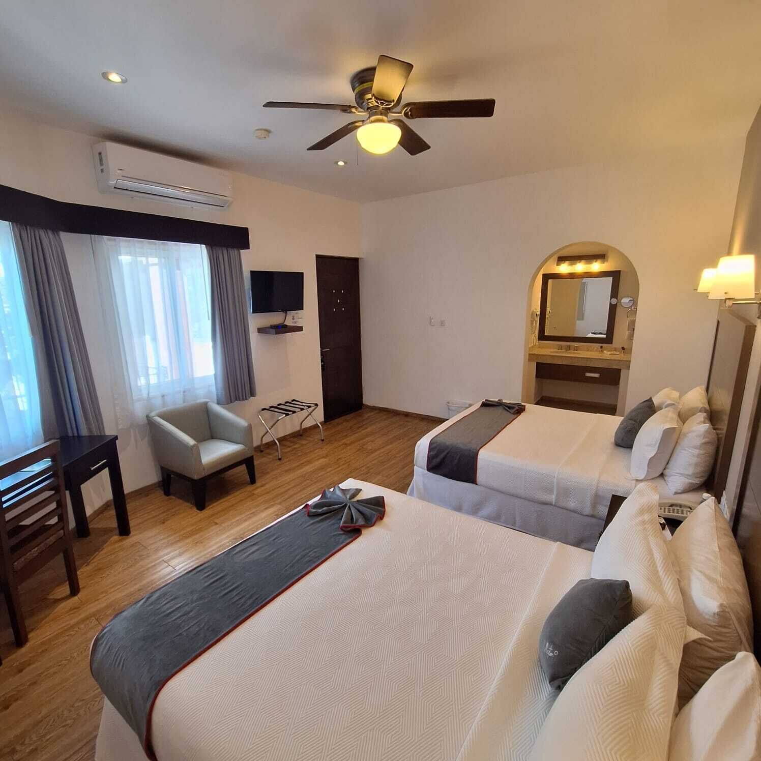 Family Room | Premium bedding, in-room safe, desk, iron/ironing board (on request)